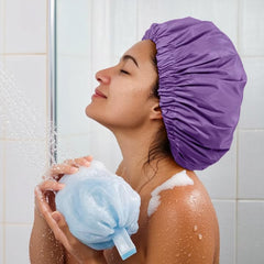 Edoneery foldable travel shower cap fits in luggage for on-the-go use.