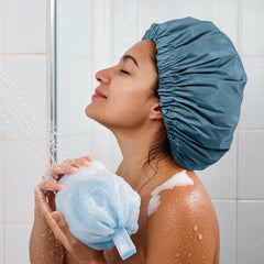 Edoneery haze blue shower cap folded for travel saves space.