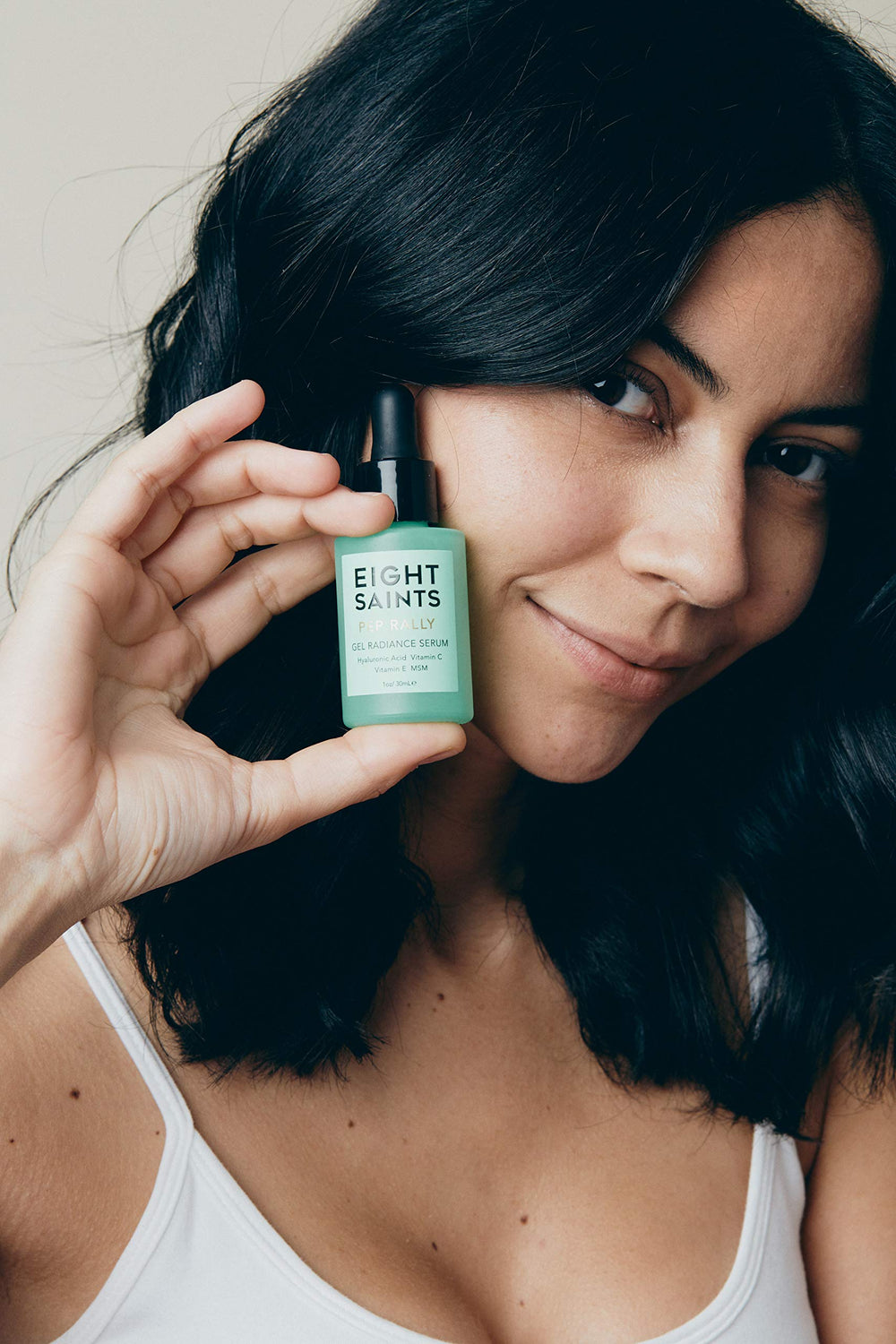 Eight Saints Hyaluronic Serum applied to cheek for plump, smooth appearance