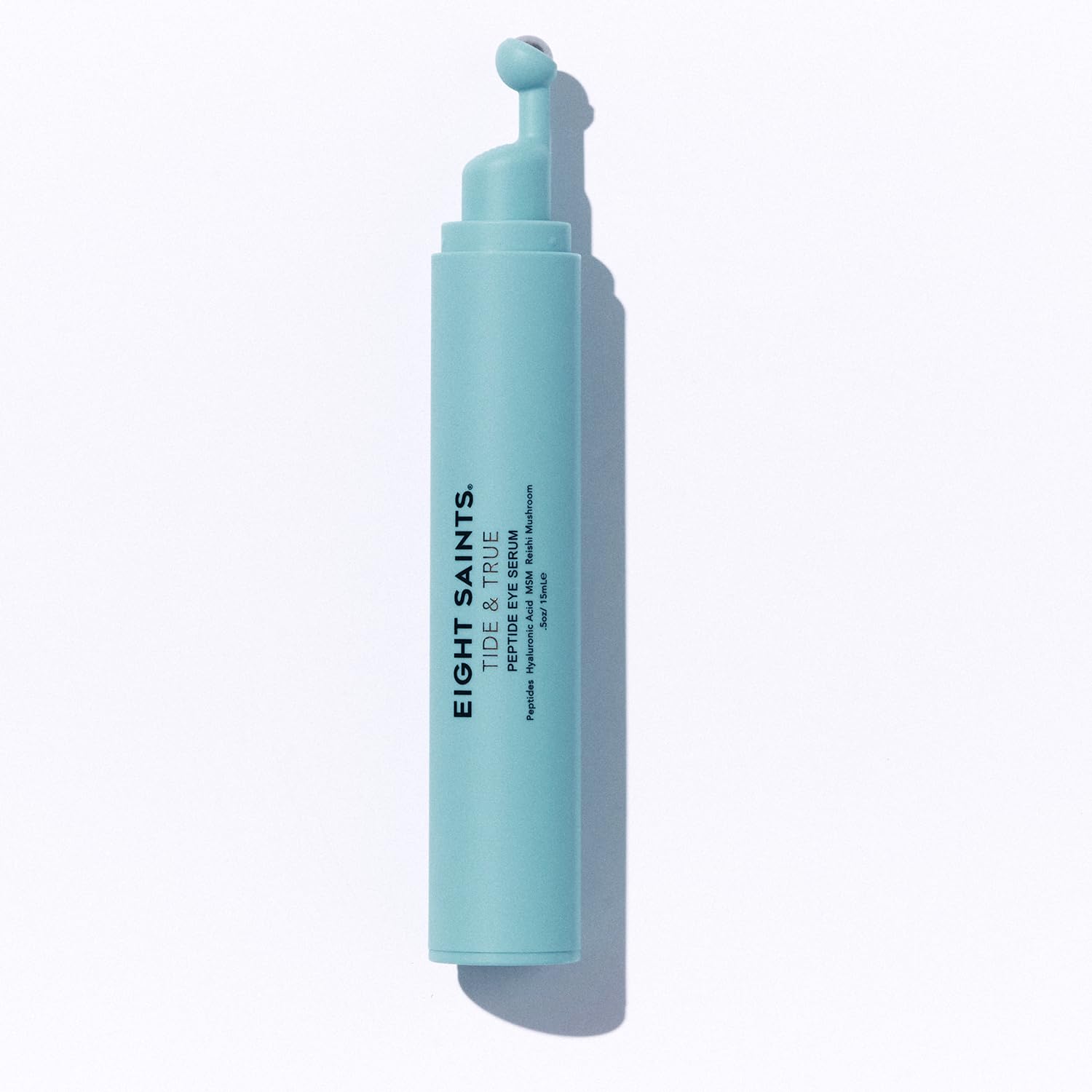 Eight Saints Tide & True Eye Serum bottle close-up, lightweight de-puffing formula.