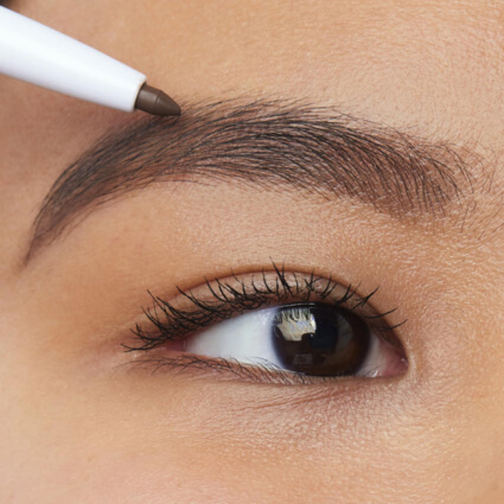 e.l.f. Instant Lift Brow Pencil spoolie action shaping brows for natural definition.