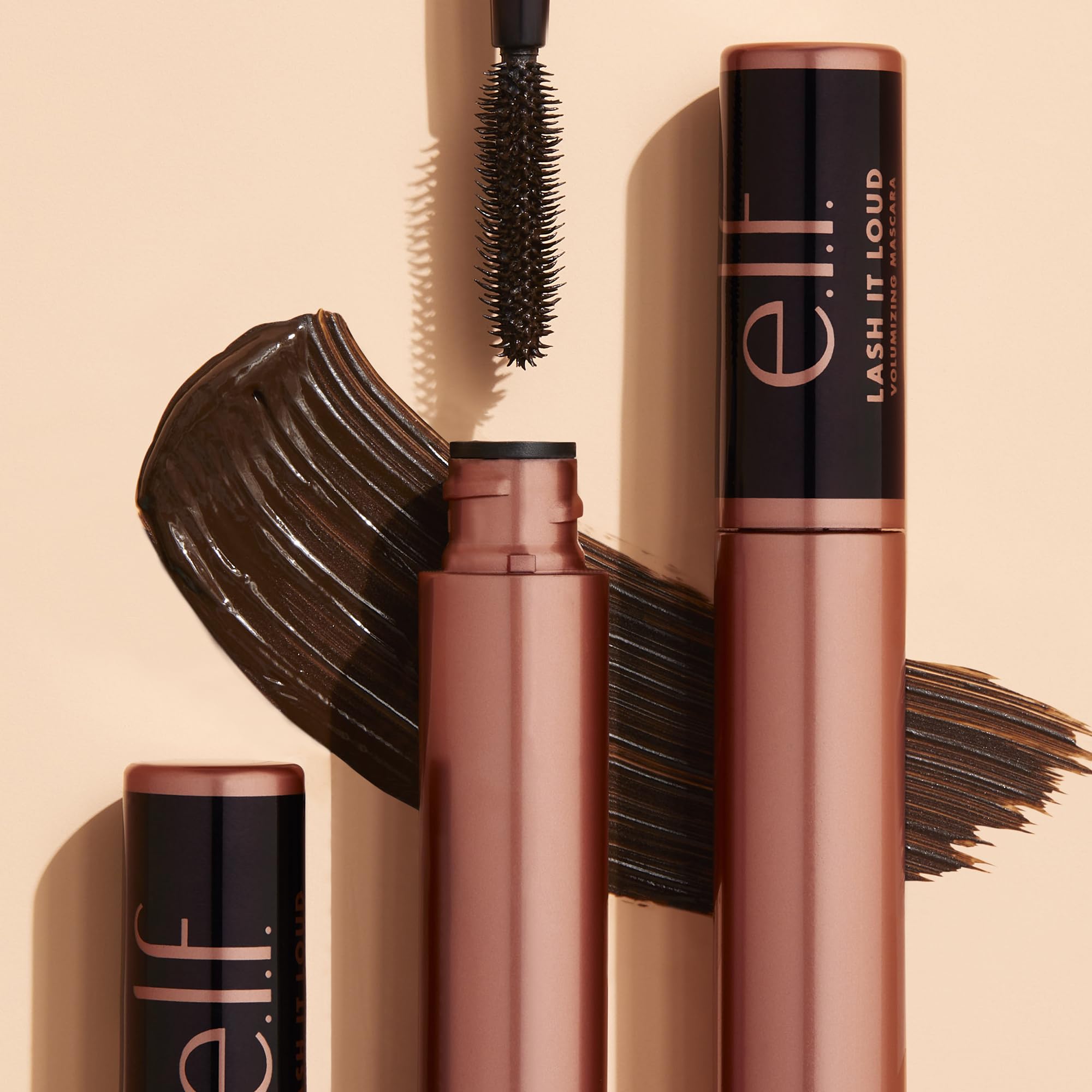 Detail of the Lash It Loud brush with vertical and horizontal bristles.