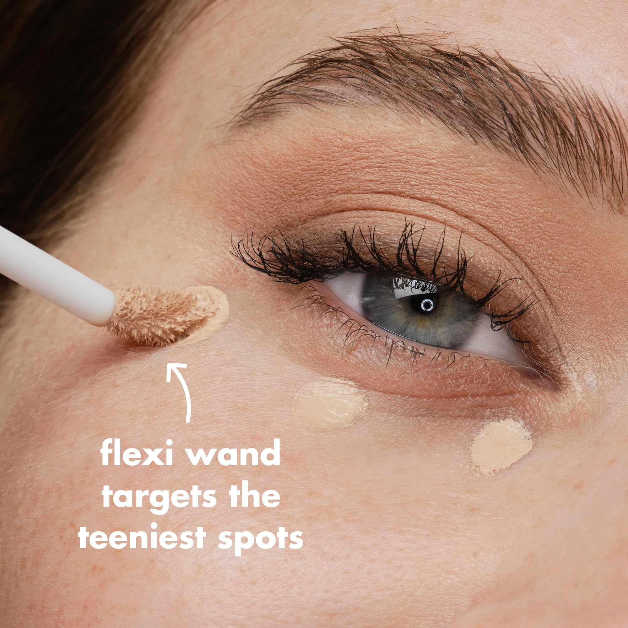 concealer covering a dark spot for an even skin tone with e.l.f.