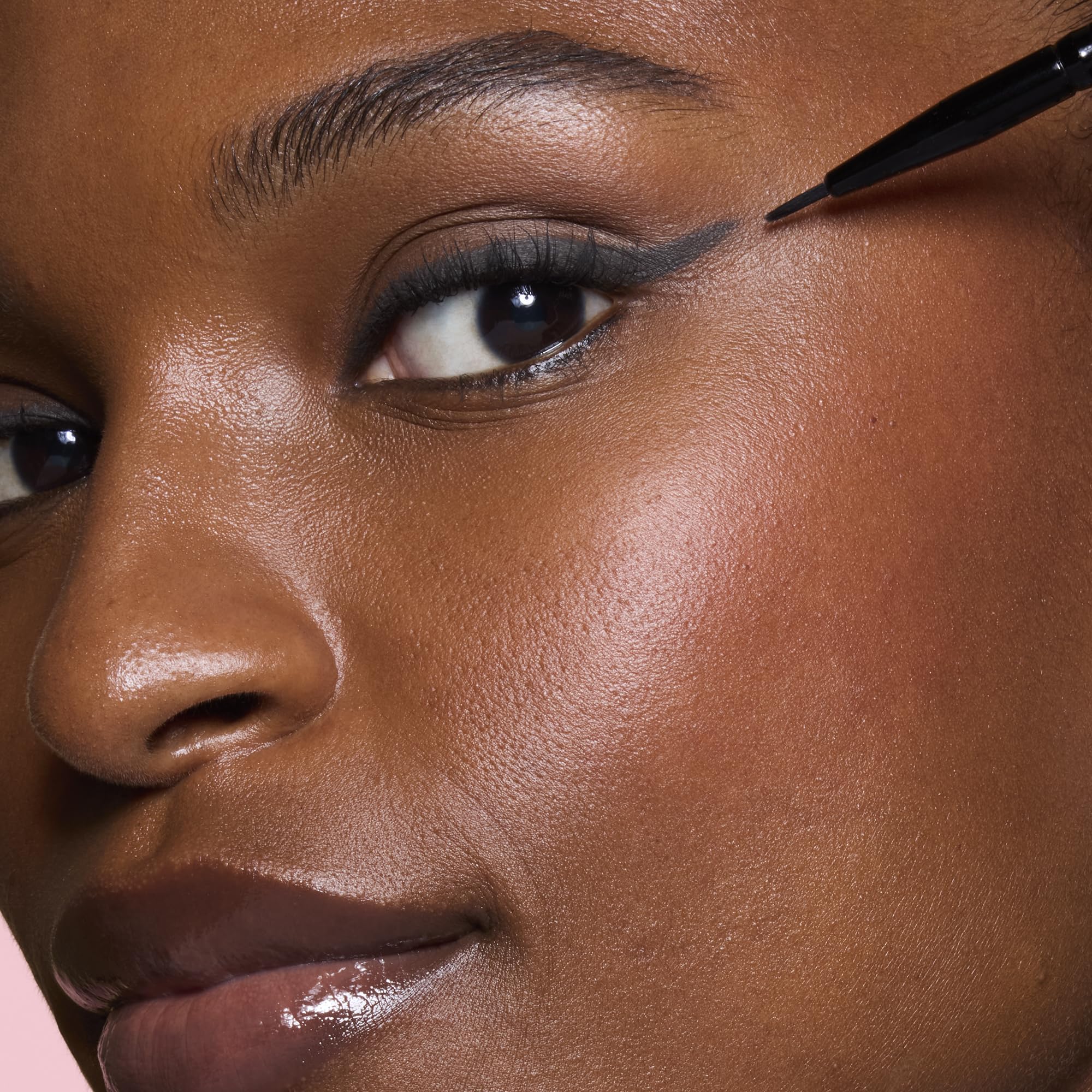 e.l.f. Ultra-Fine Eyeliner Brush used with liquid formula for clean strokes.