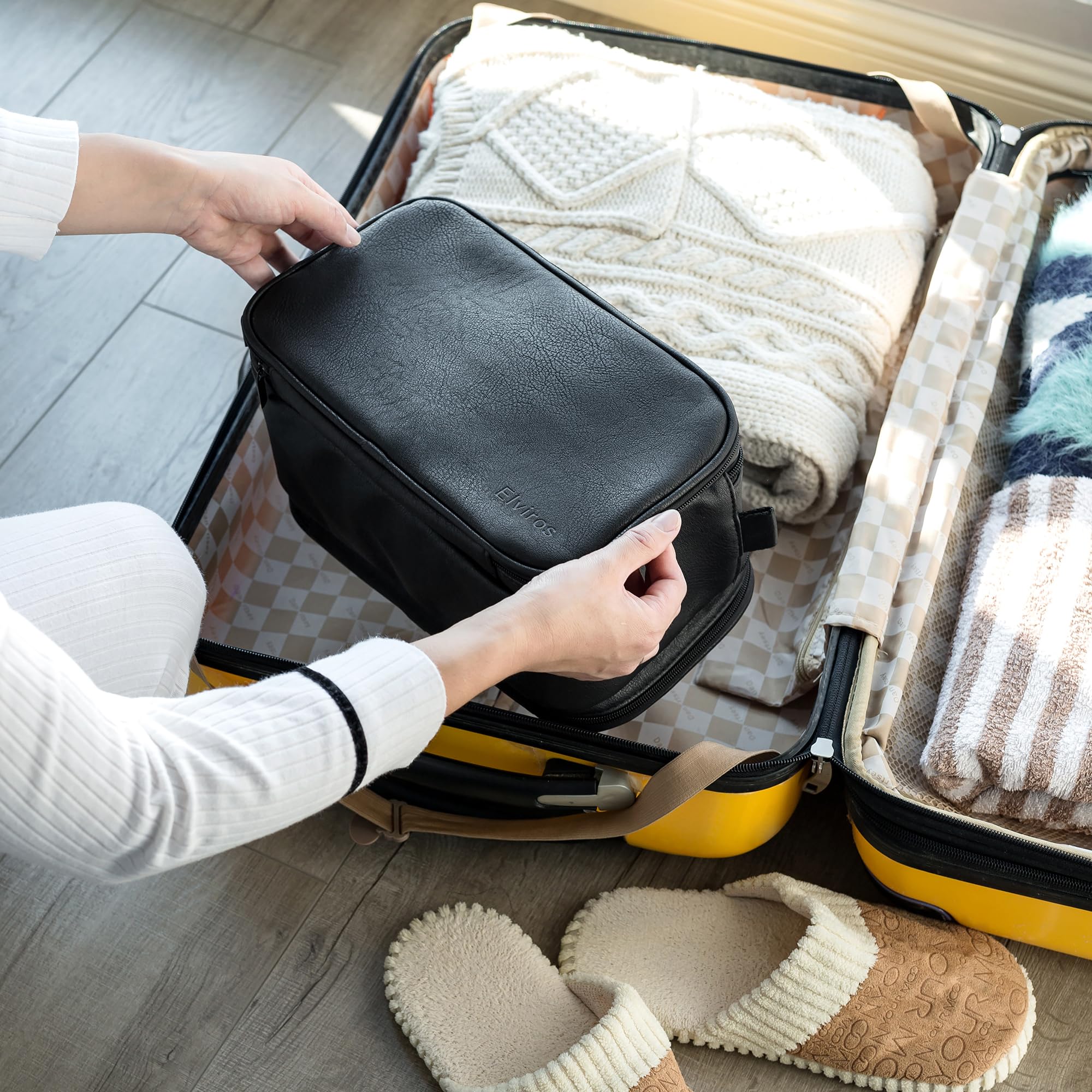 Elviros Toiletry Bag includes a waterproof compartment to contain damp items.