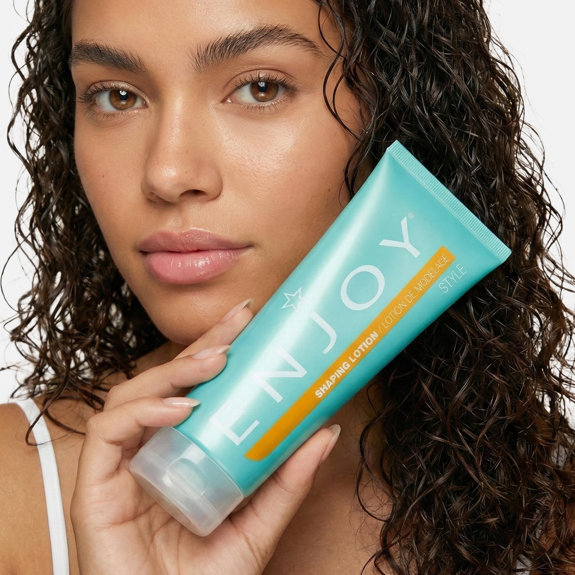 Color-safe Enjoy Shaping Curly Hair Styling Cream preserves color while adding shine.