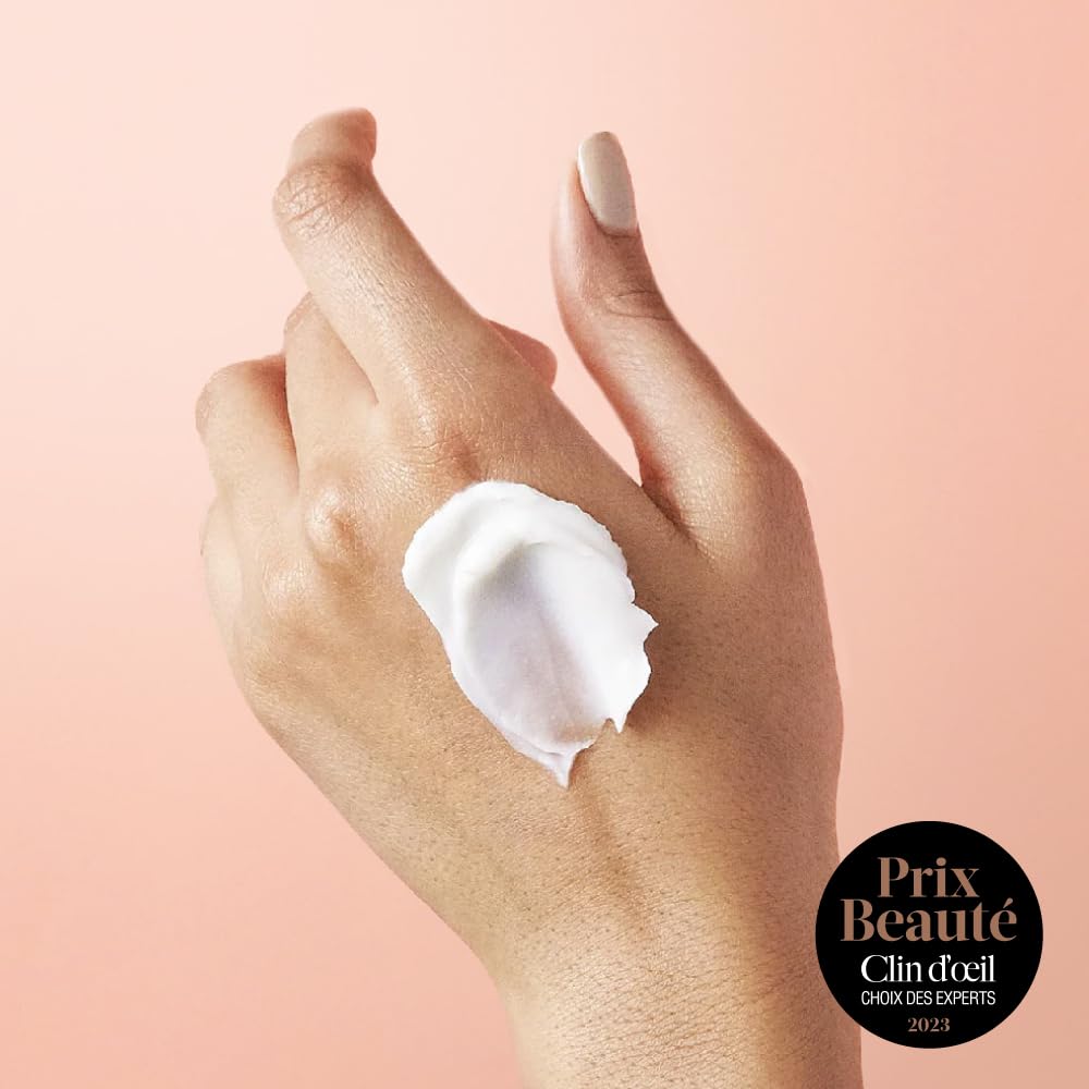 eos Vanilla Cashmere hand cream applied for immediate moisture on hands
