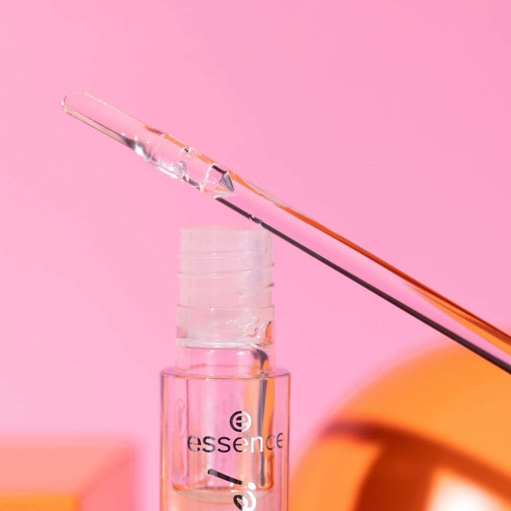 essence bold glass finish close-up demonstrates luminous, statement lip look.