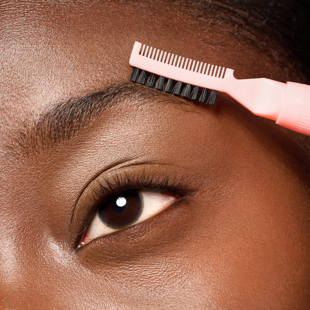 essence brow lift & freeze glue applied with upward strokes.