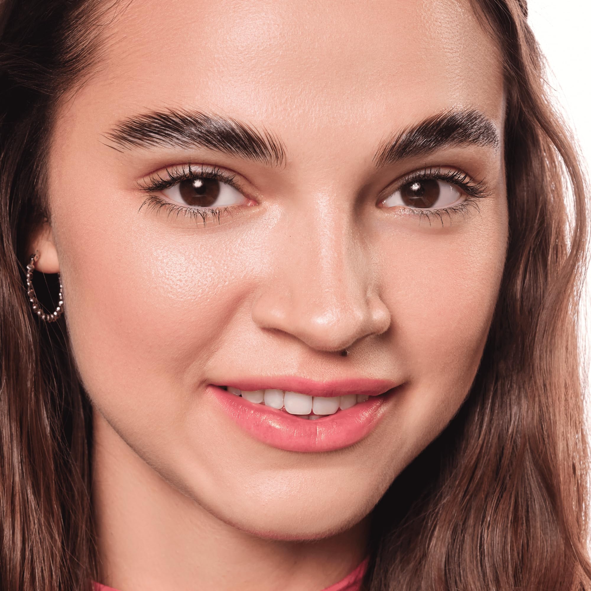 essence brow lift & freeze glue brush in action for grooming.