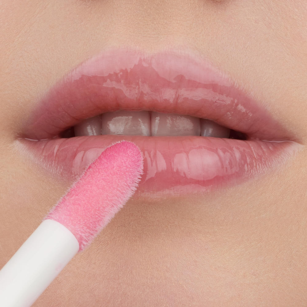 essence Hydra Kiss Lip Oil provides a high-shine finish.