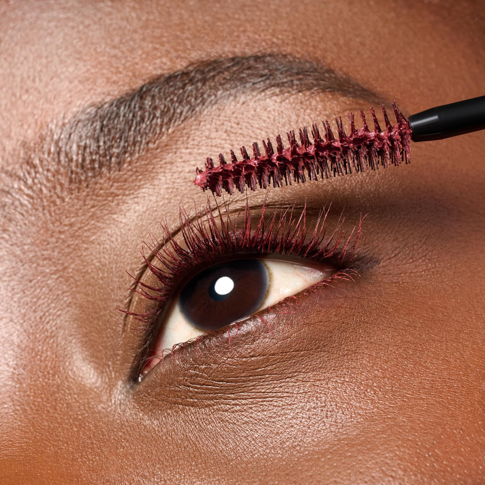 essence Lash Princess Burgundy eye look showcasing color with defined lashes