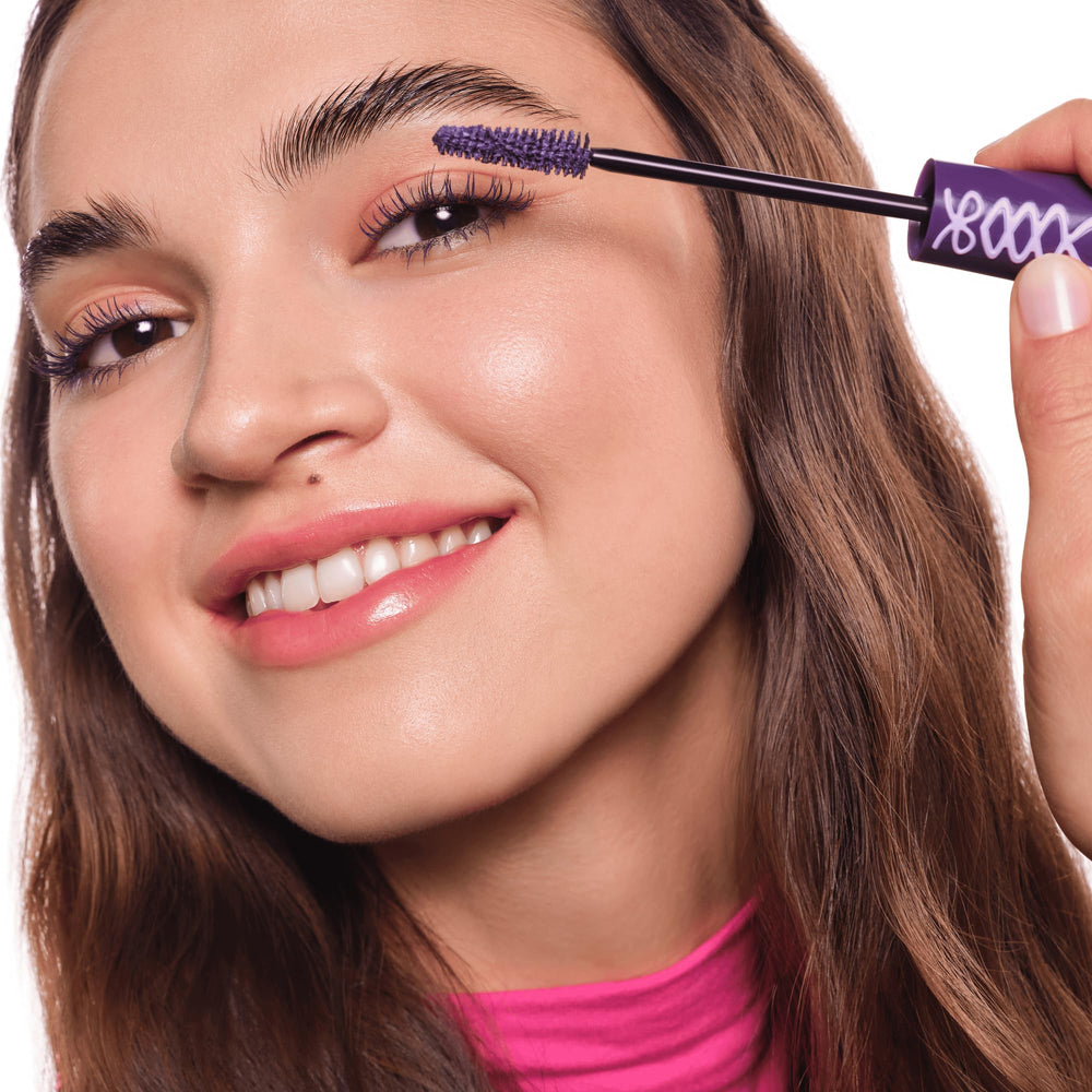 essence Lash Princess Purple tube open with wand visible for application.