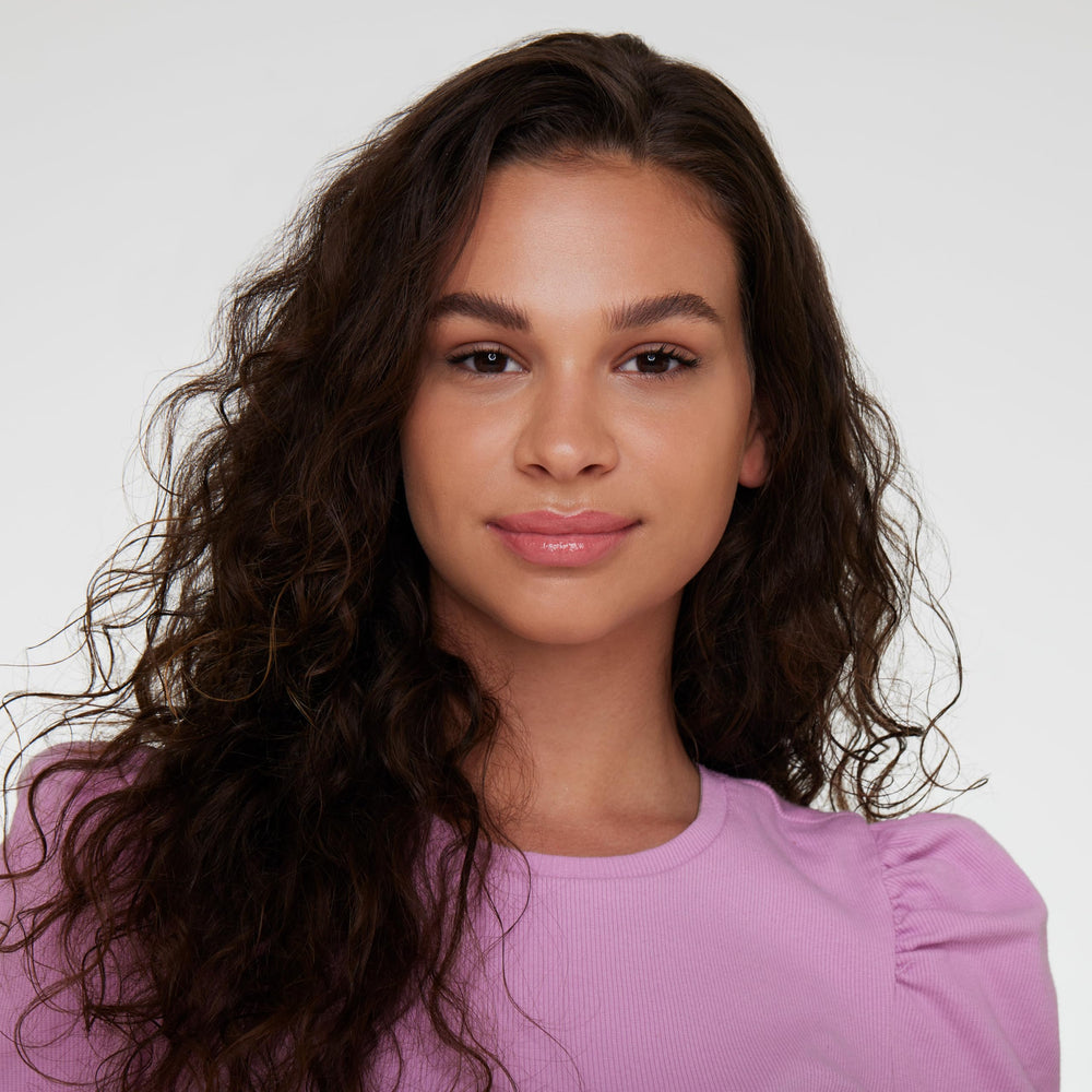 essence What the Fake gloss on lips delivers plush, pearly nude glow with hydration.