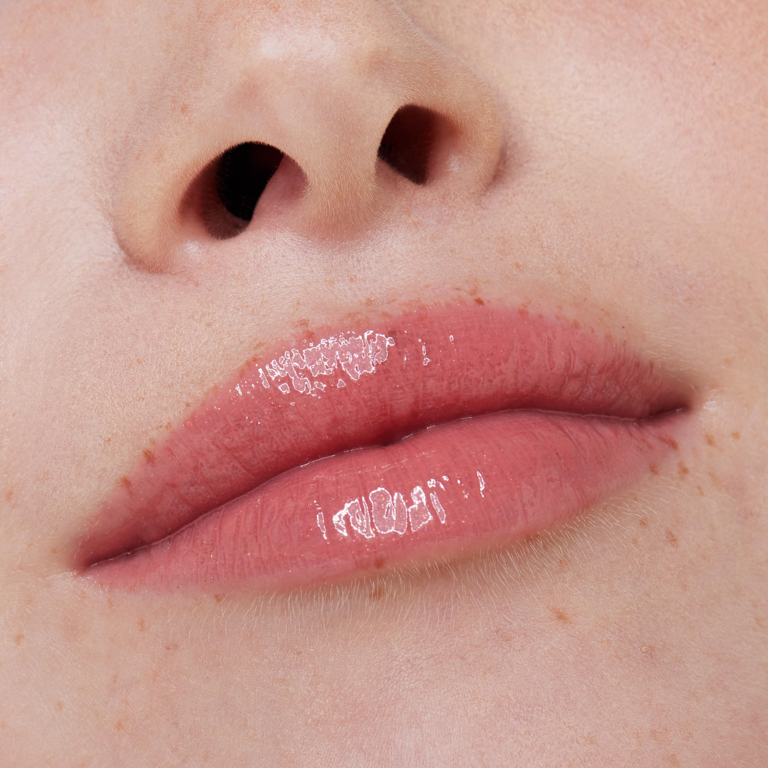 essence What the Fake lip gloss provides a gentle cinnamon tingle for a plump look.