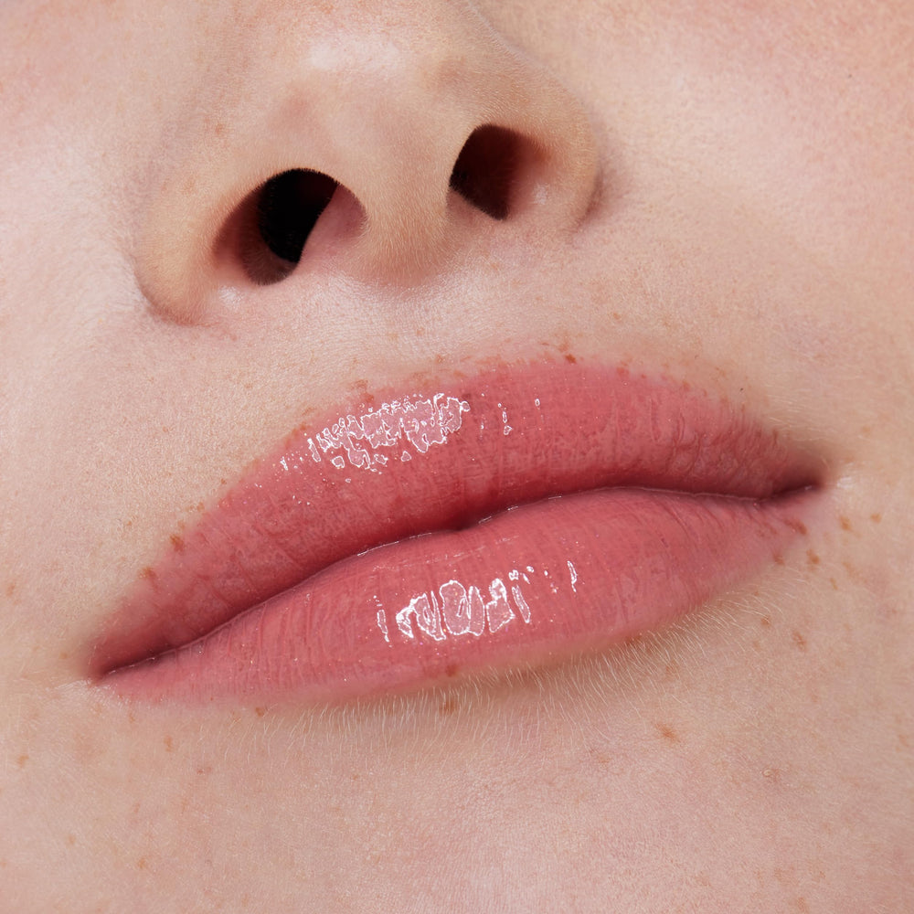essence What the Fake lip gloss provides a gentle cinnamon tingle for a plump look.
