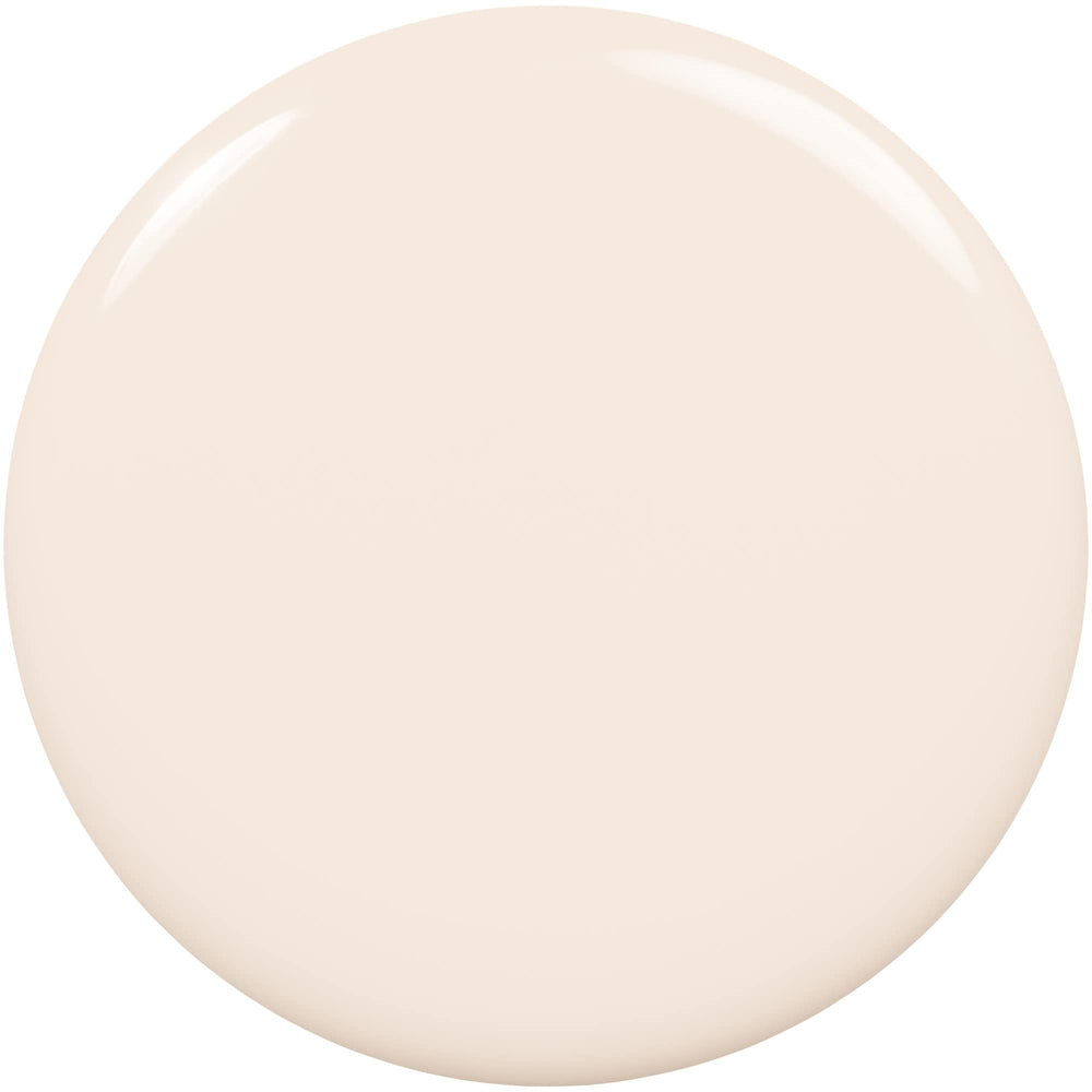 Acabado crema suave Daily Grind, tono blanco neutro para looks discretos.