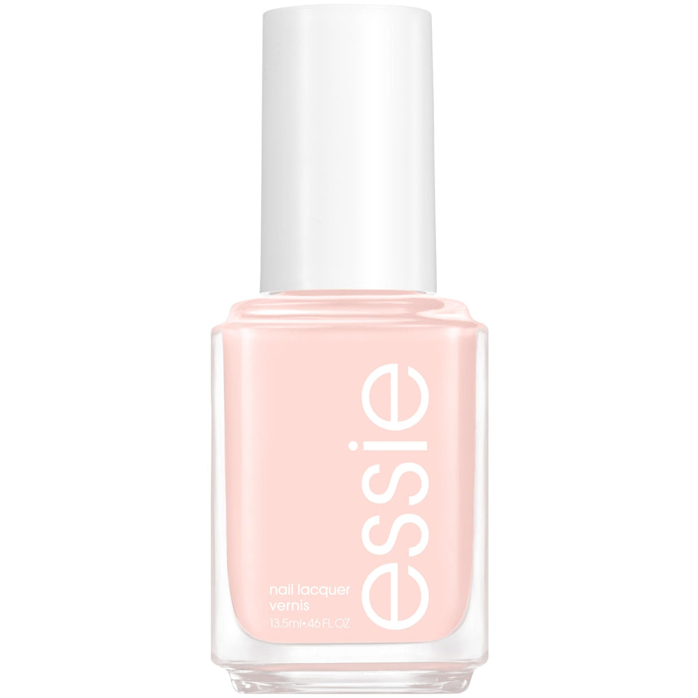 essie Skinny Dip bottle closeup showcasing a glossy peach shade for salon-like nails.