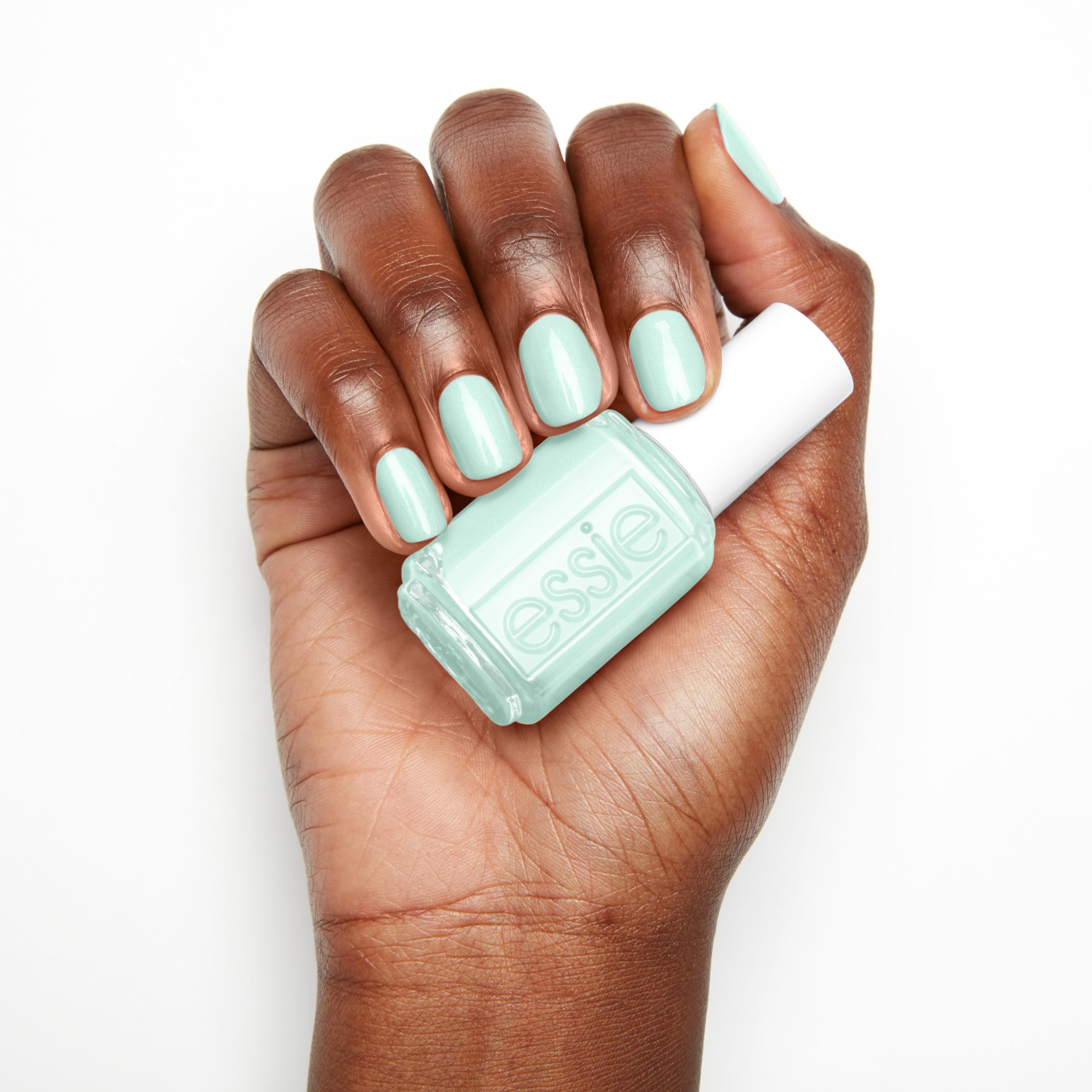 essie Seas The Day on sun-kissed nails during a summer beach day