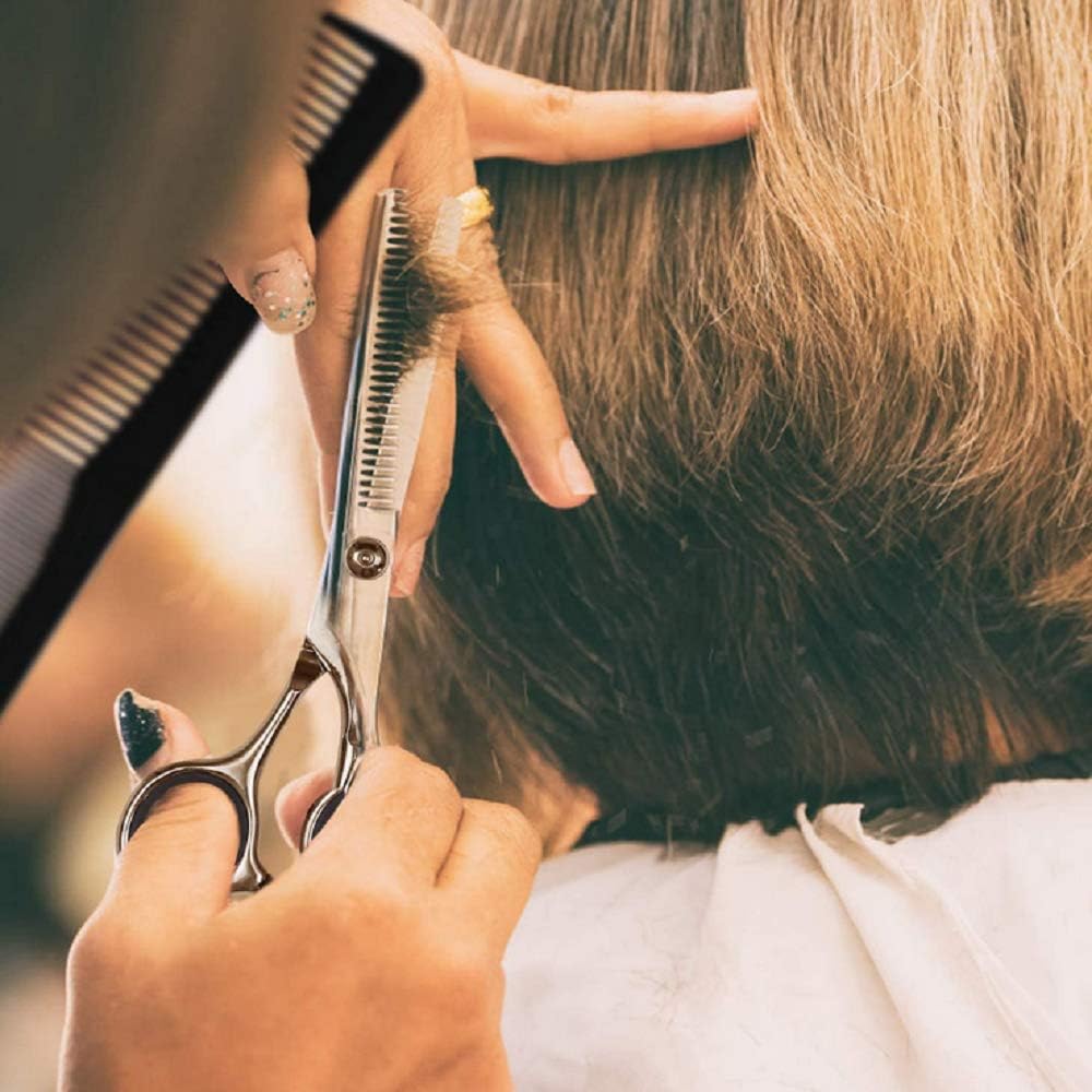 Essoy thinning scissor close-up shows sharp blades ready for precise texturing.