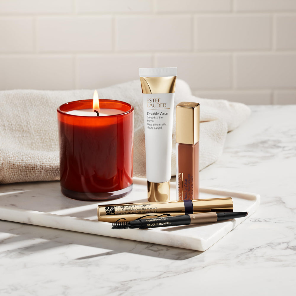 Estée Lauder Brow Multi-Tasker spooled brush styling and setting the brows