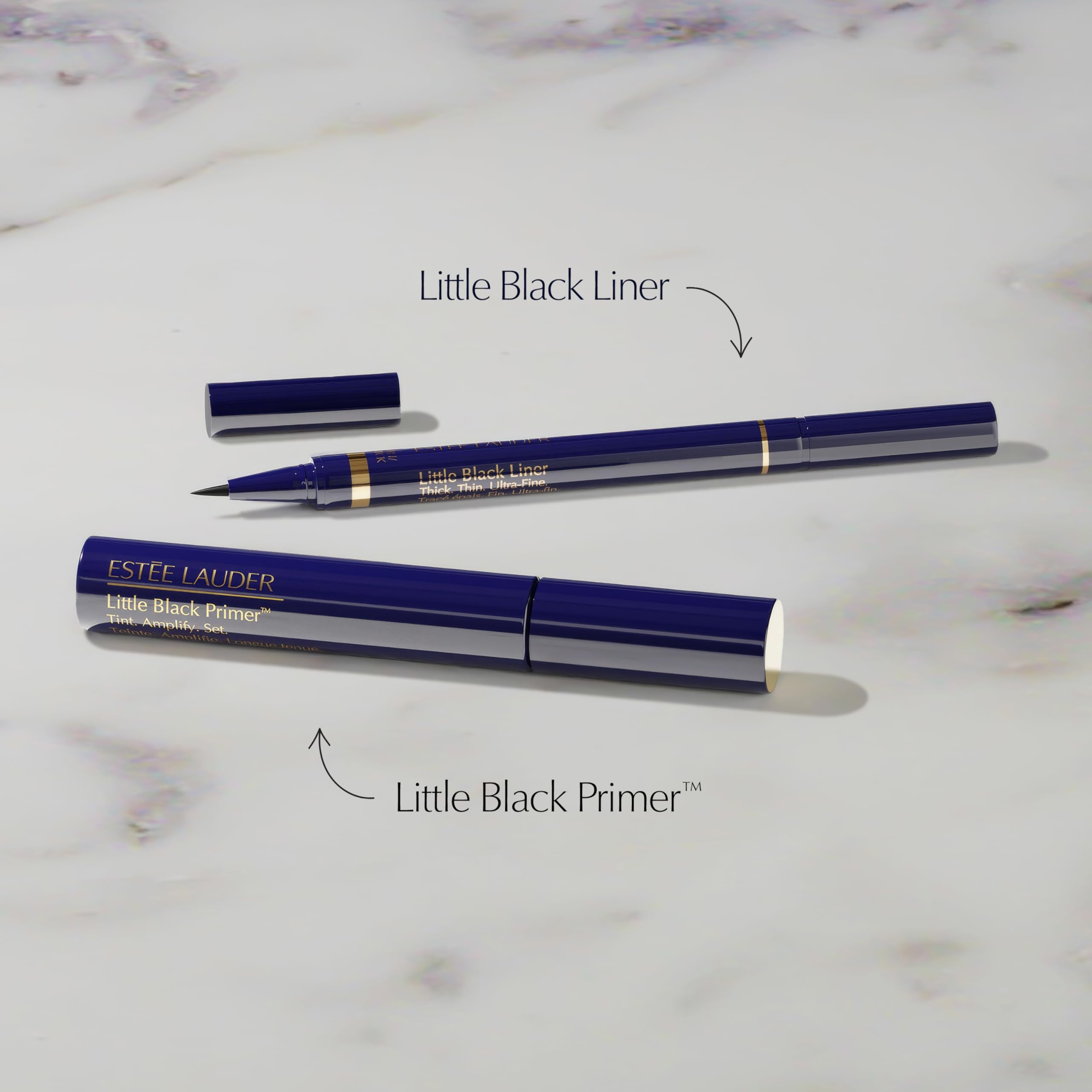 Estée Lauder Little Black Primer Tint wand applying for defined lash base.