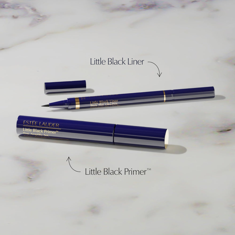 Estée Lauder Little Black Primer Tint wand applying for defined lash base.
