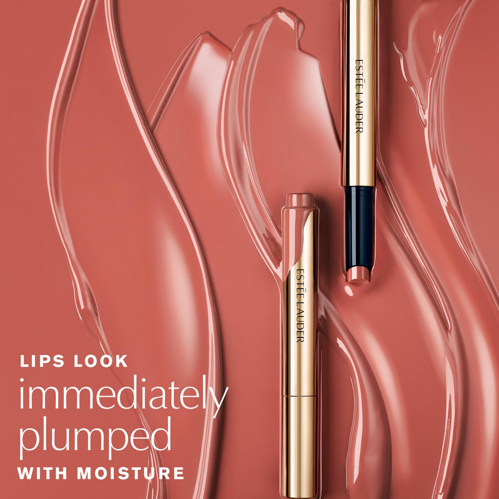 Close-up of Estee Lauder Melt-On Glosstick Melted Melon cap and warming formula.