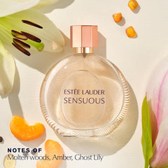 Estée Lauder Sensuous bottle close-up, warm amber hues evoke molten woods