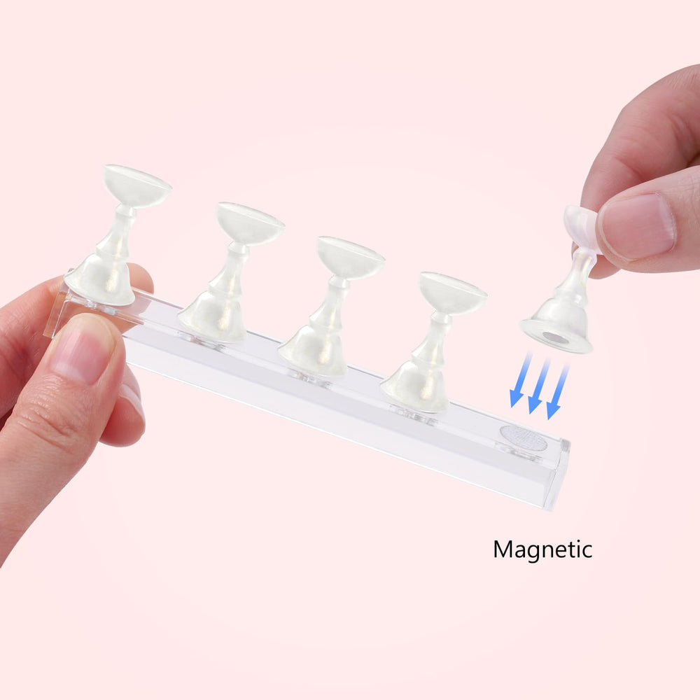 Etercycle magnetic-base close-up demonstrates firm hold during detailed nail art.