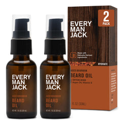 Every Man Jack Beard Oil bottle pouring subtle aged bourbon aroma for refined grooming.