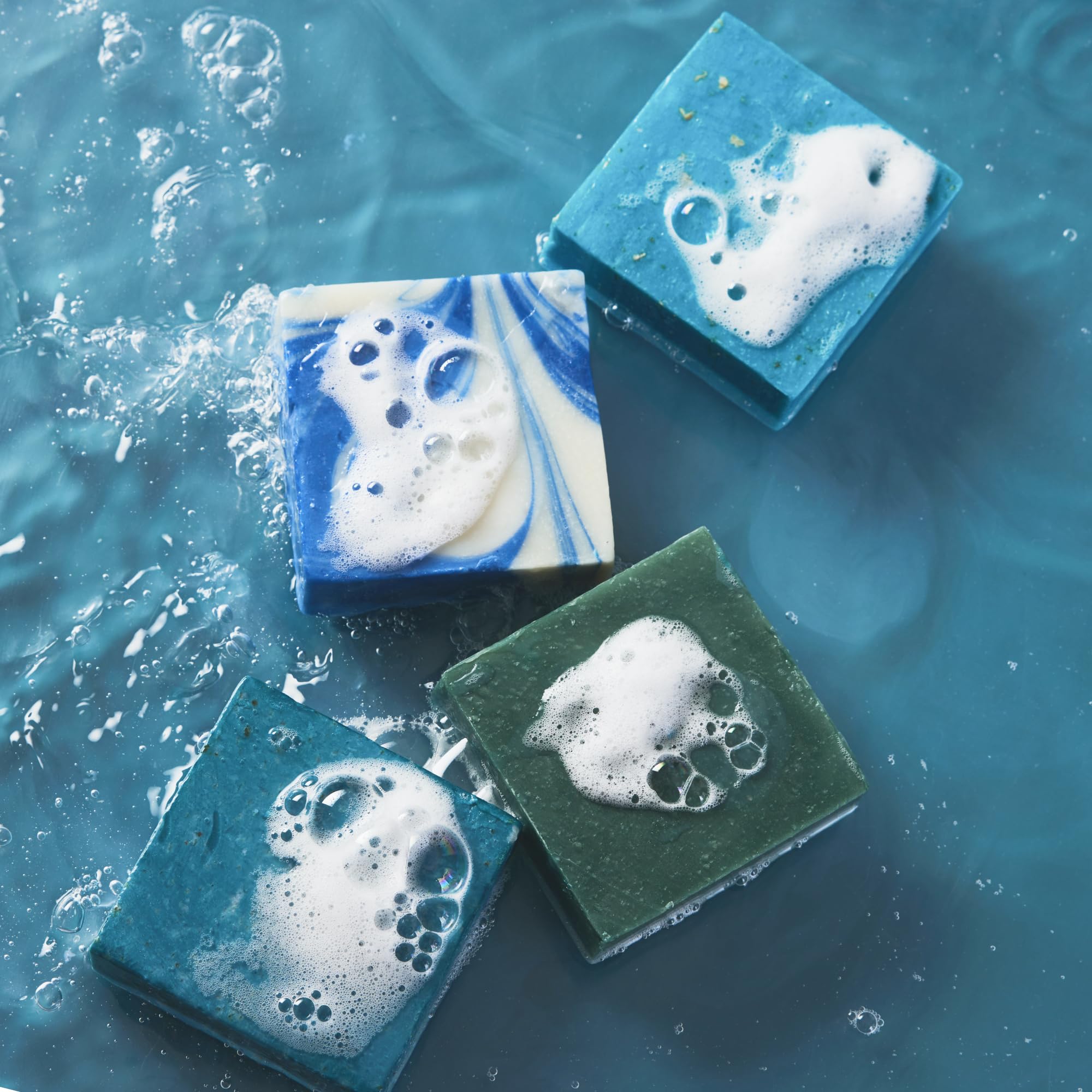 Every Man Jack Cold Plunge soap lather shown with loofah for rich foam.