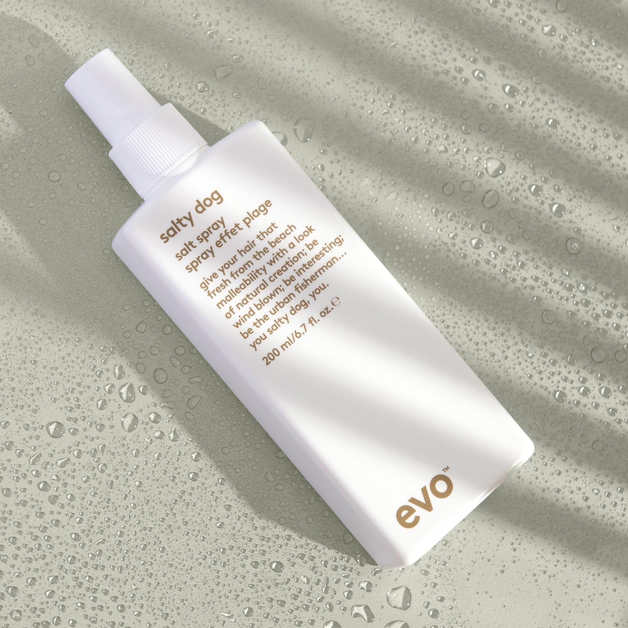 EVO Salty Dog sea salt spray in hand demonstrates quick styling.