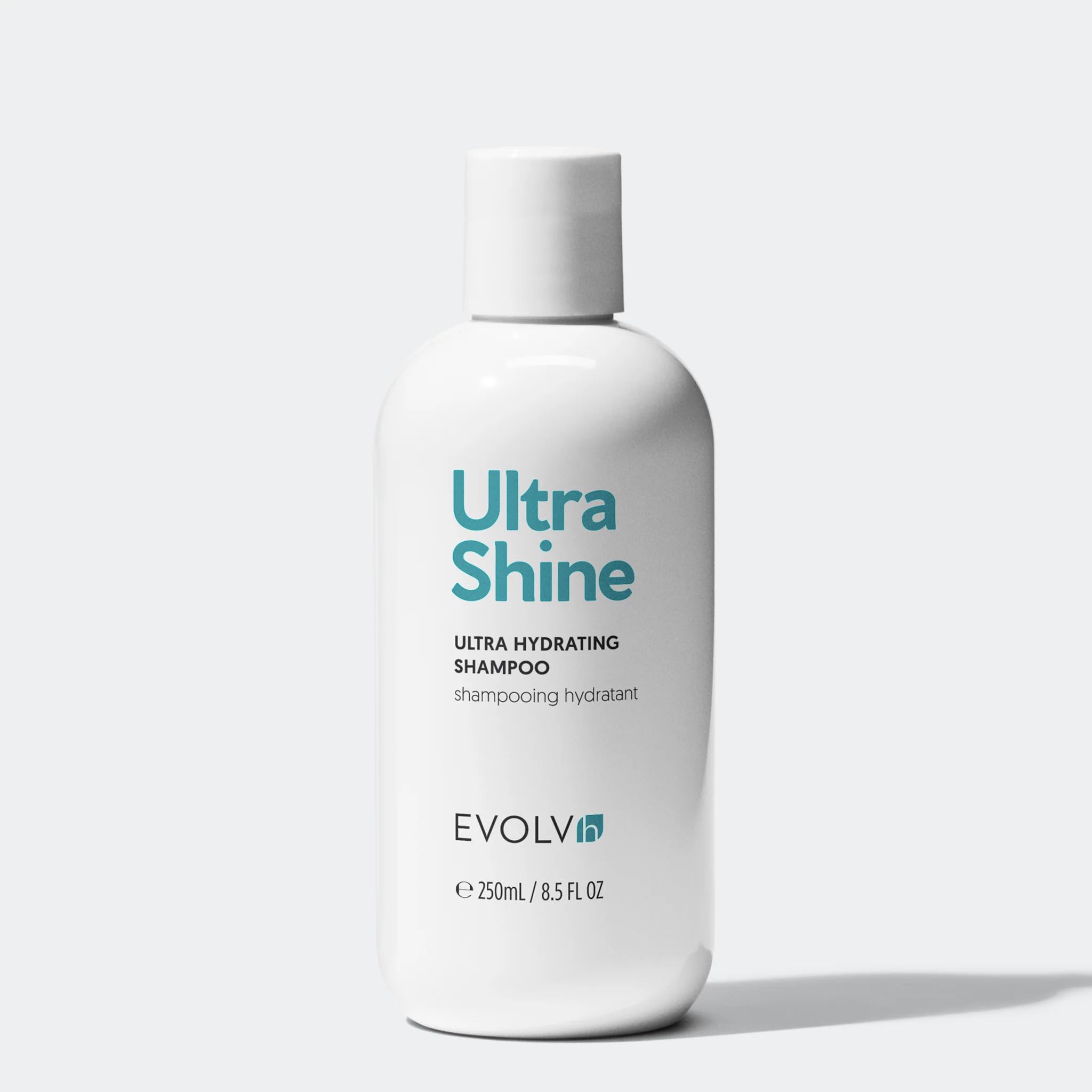 EVOLVh bottle paired with conditioner routine guidance poster