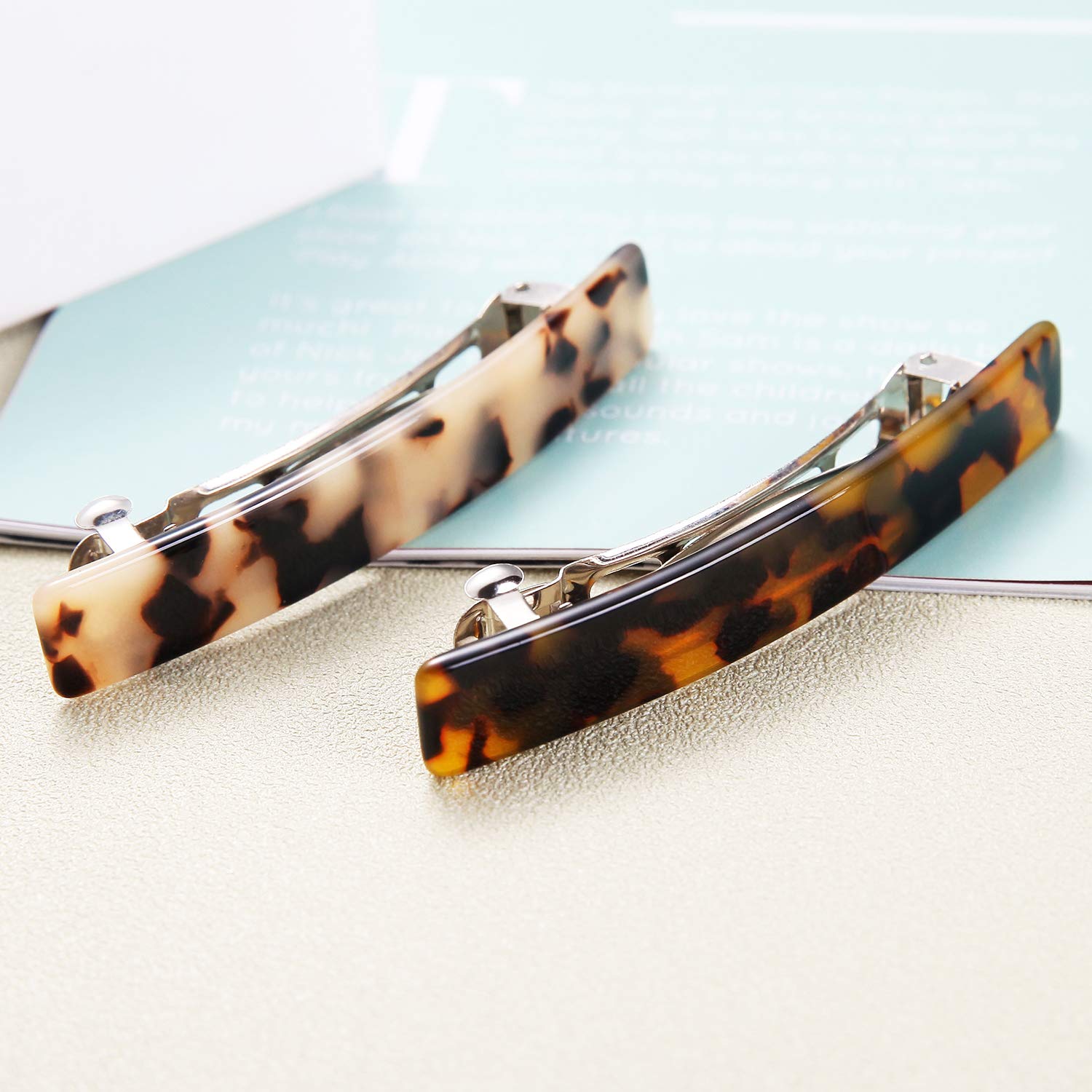 Eyegla tortoise shell rectangle barrette securing straight, smooth hair