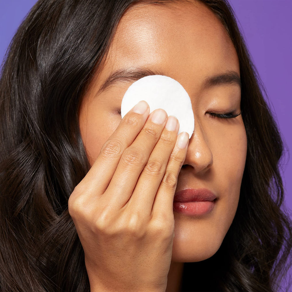 FALSCARA KISS remover rosewater droplets close-up conveying soothing care.