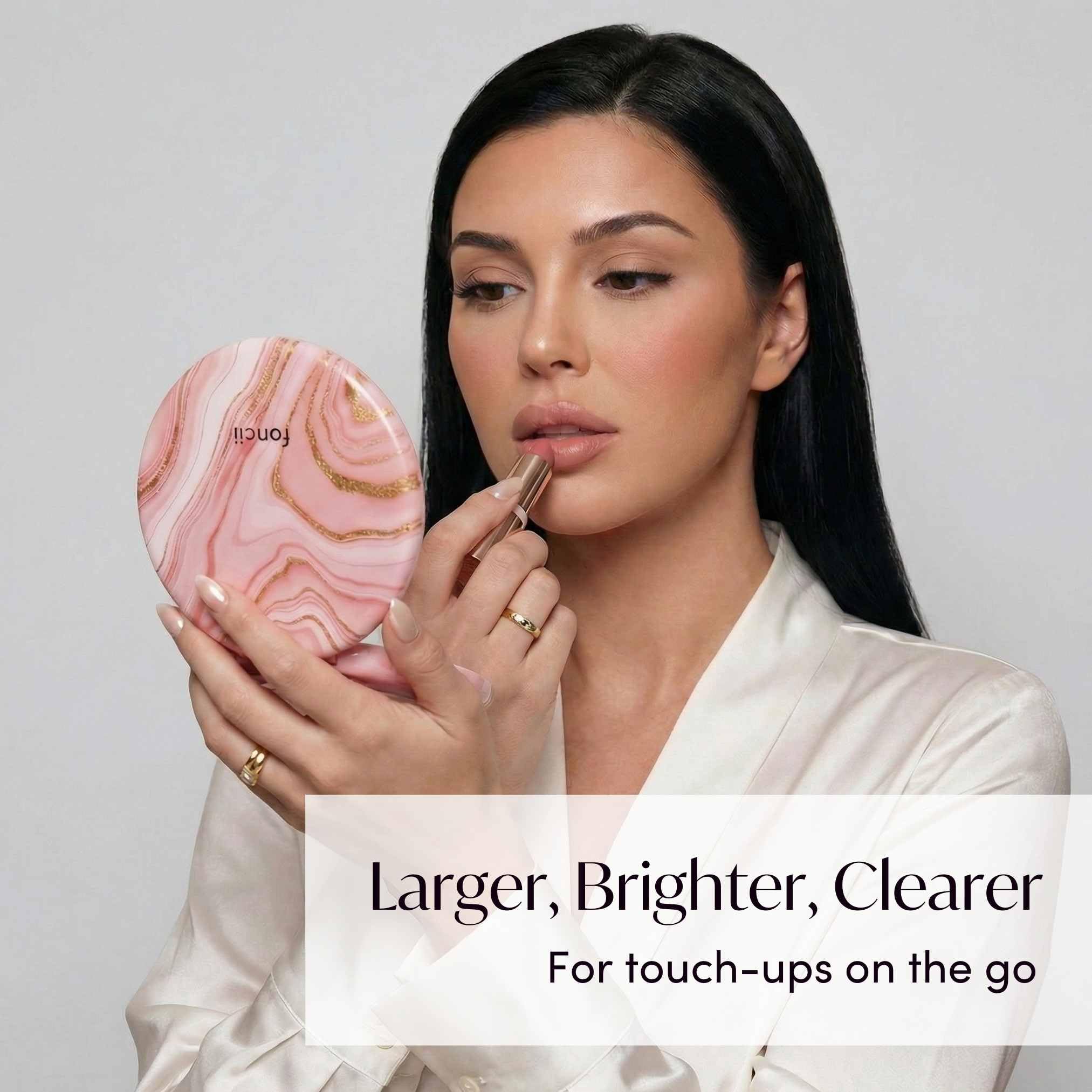 Fancii Taylor double-sided magnification for quick makeup and detail work.