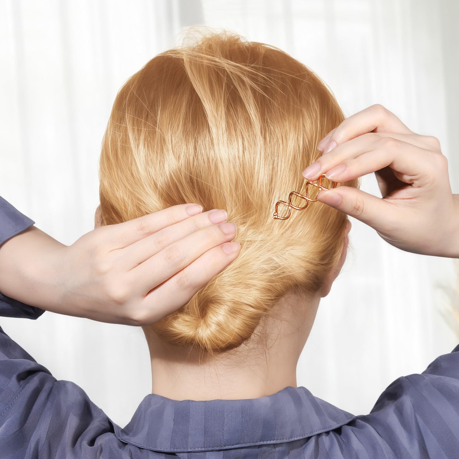 Fandamei spiral hair pin in hand showing lightweight design for travel.