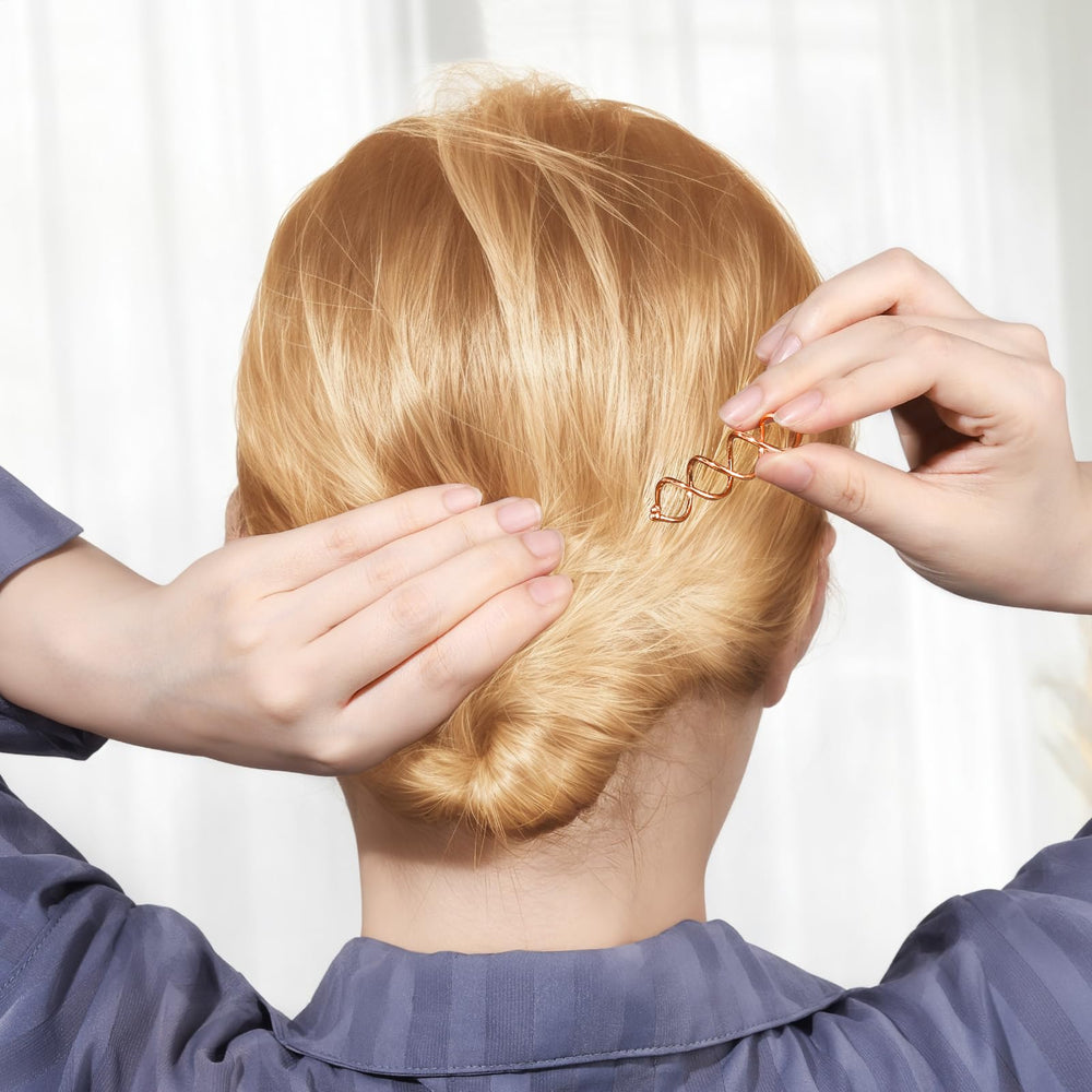Fandamei spiral hair pin in hand showing lightweight design for travel.