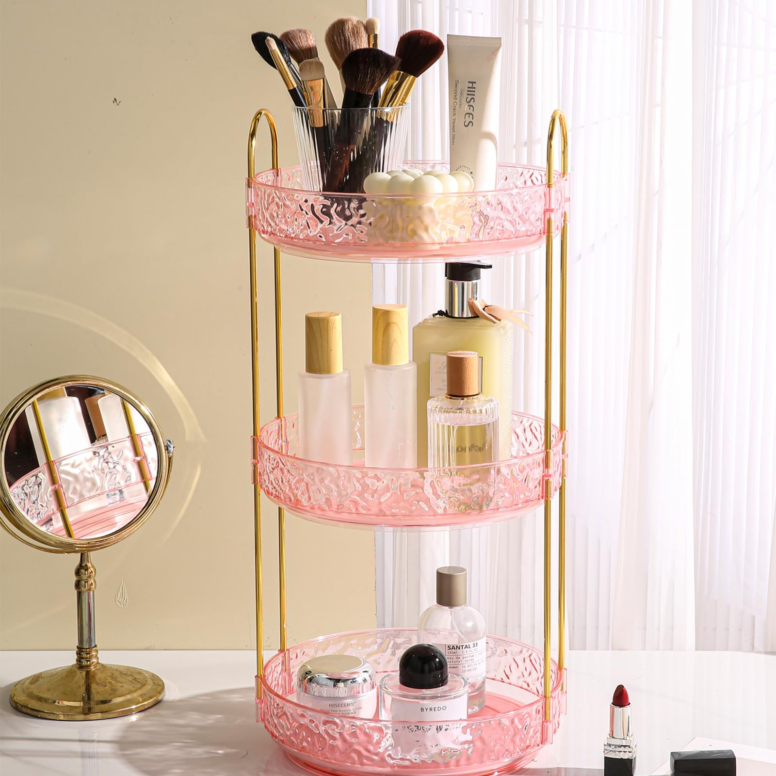 Fangoo 3-tier pink rotating makeup organizer keeps cosmetics neatly accessible.