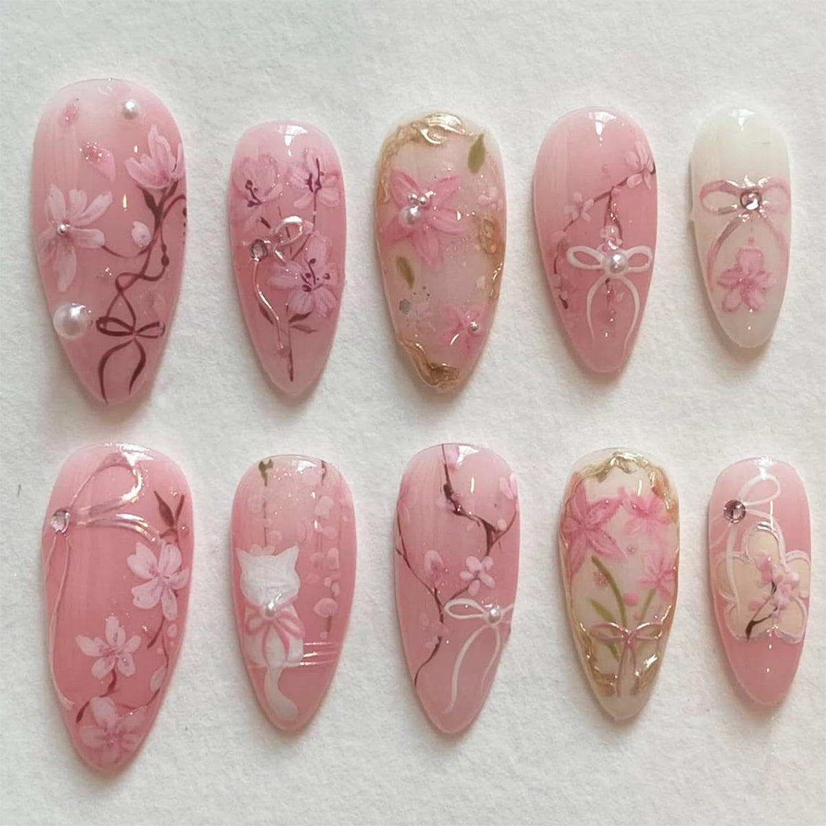 FDSQHSA uñas postizas almendra con flor rosa para un look veraniego elegante