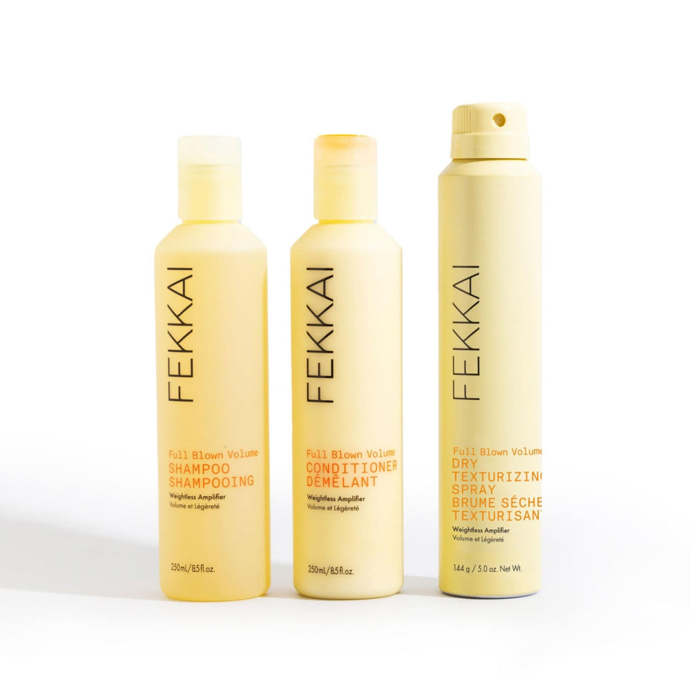 FEKKAI Full Blown Volume Shampoo bottle beside towel; color-safe for all hair types