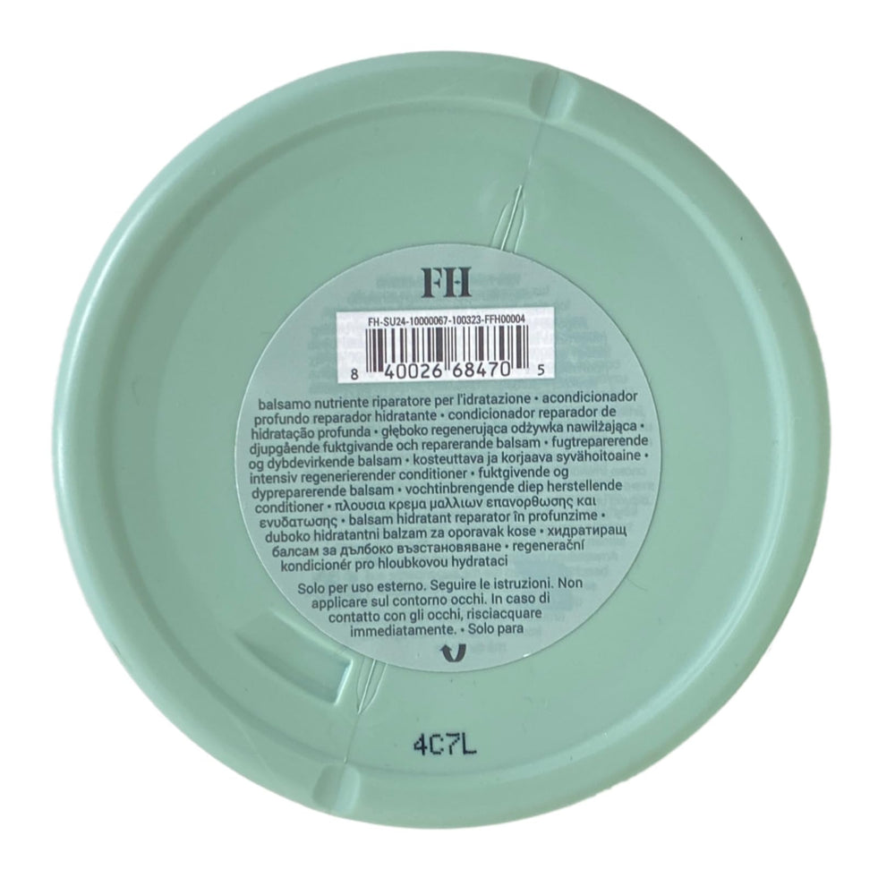 Fenty Hair The Richer One application closeup shows slip for easier detangling.