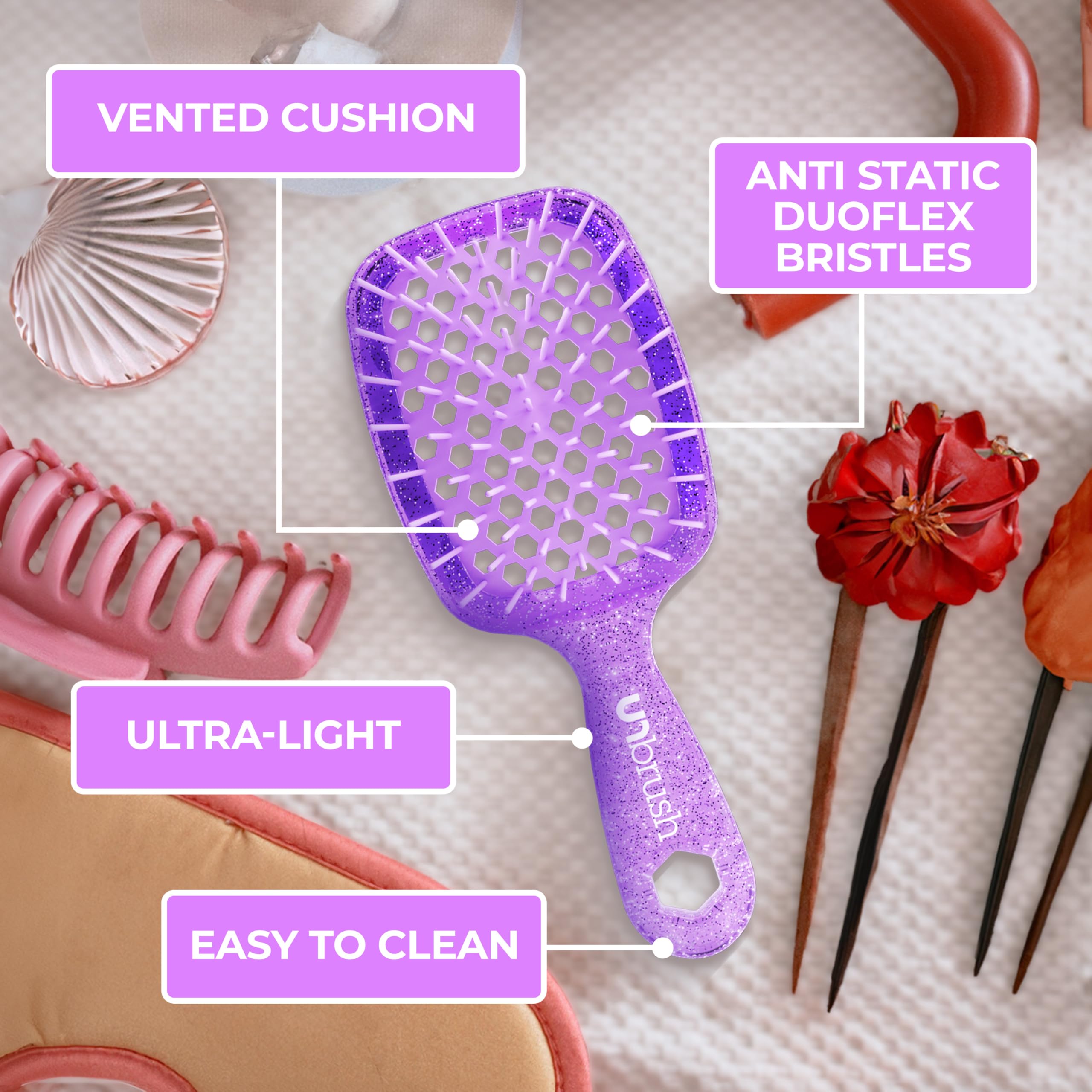 47 long bristles of the UNbrush Mini targeting knots effectively