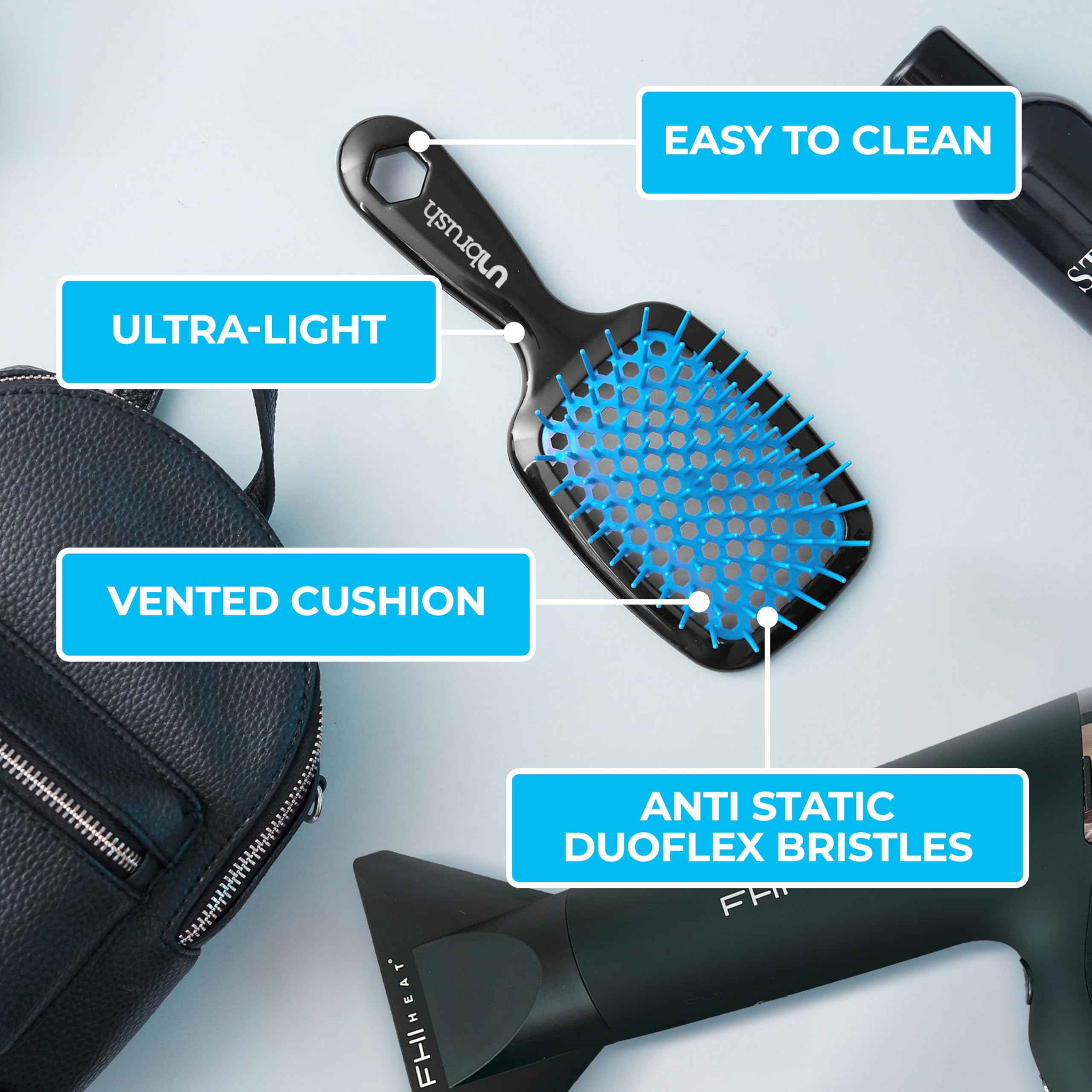 FHI Heat UNbrush detangles dry hair with gentle, snag-free performance.