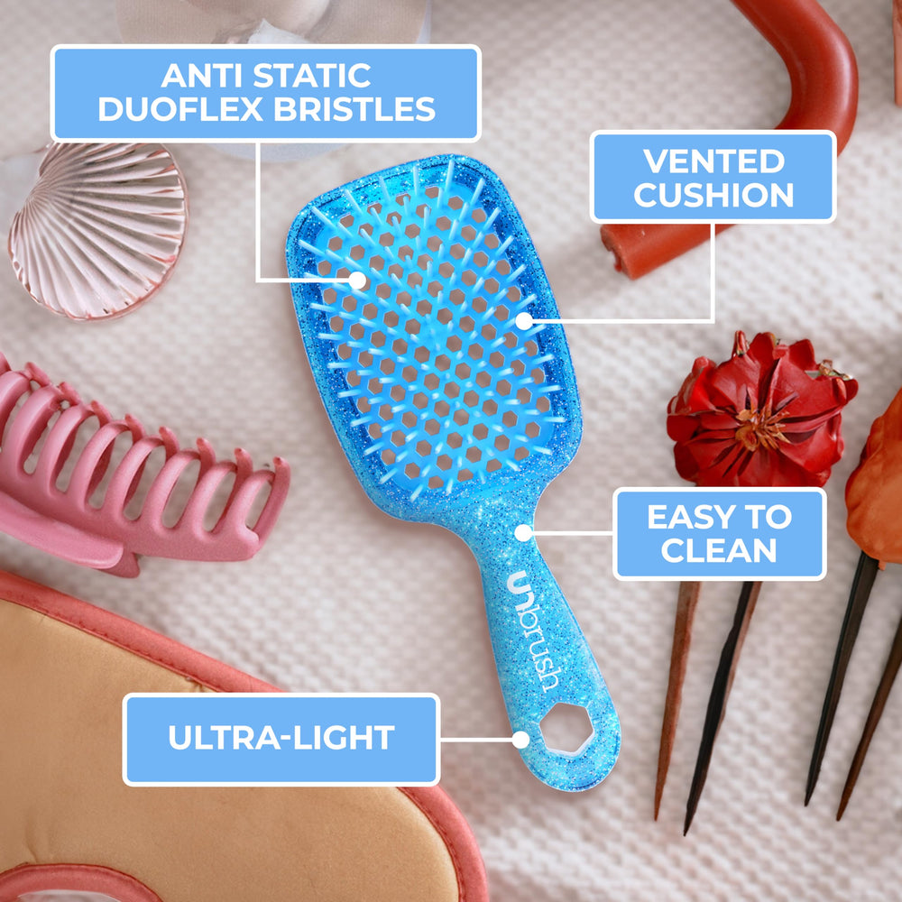 Dry hair detangling with sapphire blue UNbrush on straight hair