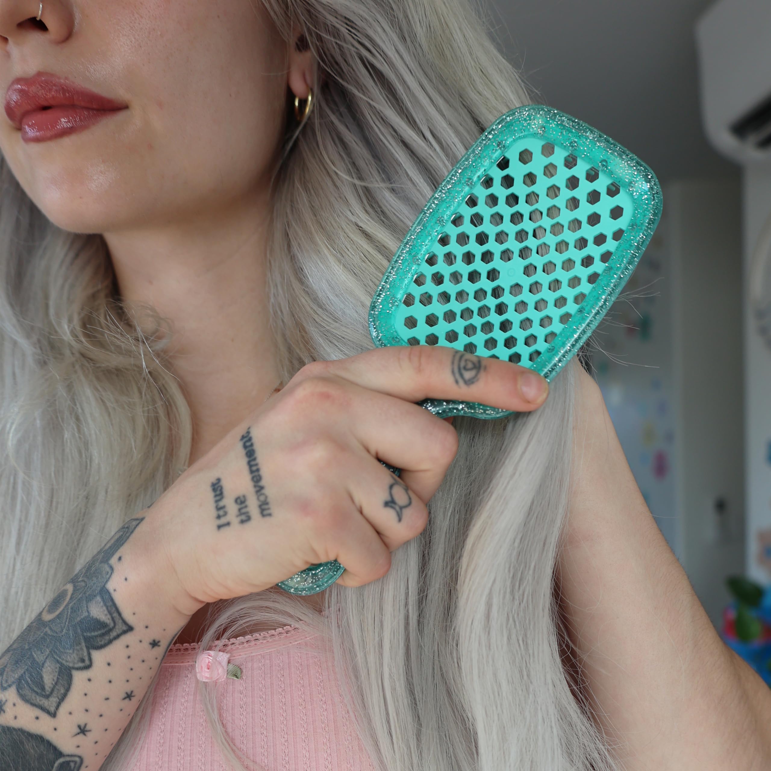 FHI Heat UNbrush compact brush for family grooming and travel.