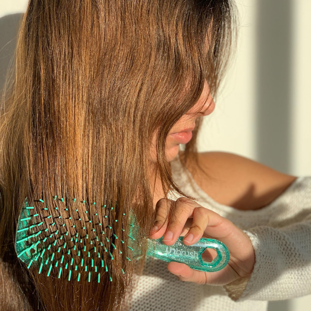 FHI Heat UNbrush long bristles target stubborn knots for thorough detangling.