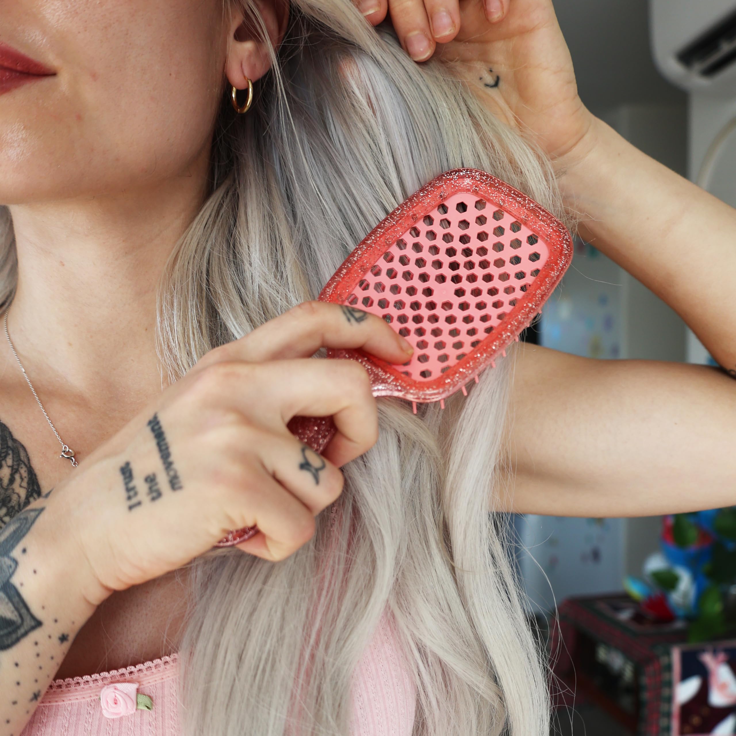 FHI Heat UNbrush Ruby Peach travel-friendly brush for on-the-go detangling.