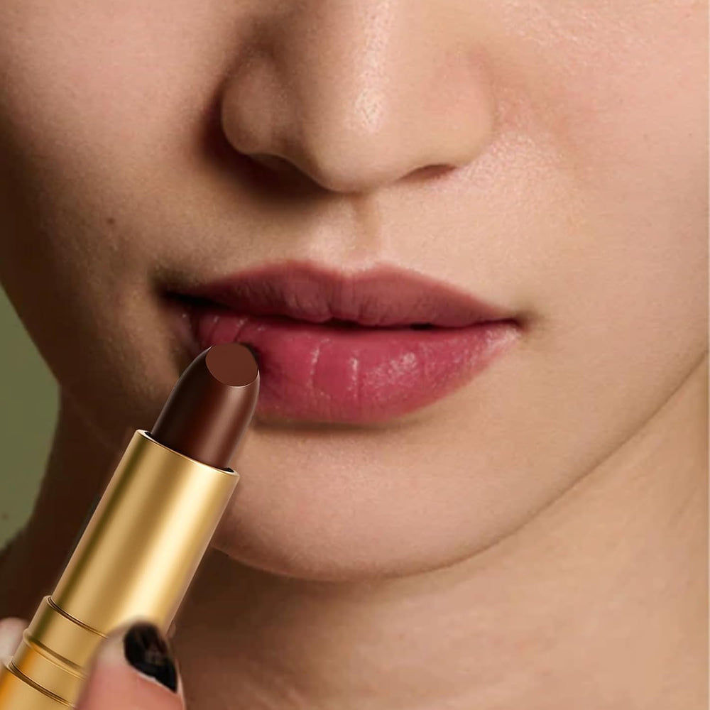 Finding Ferdinand Black Lip Balm berry shade application shows sheer, buildable tint
